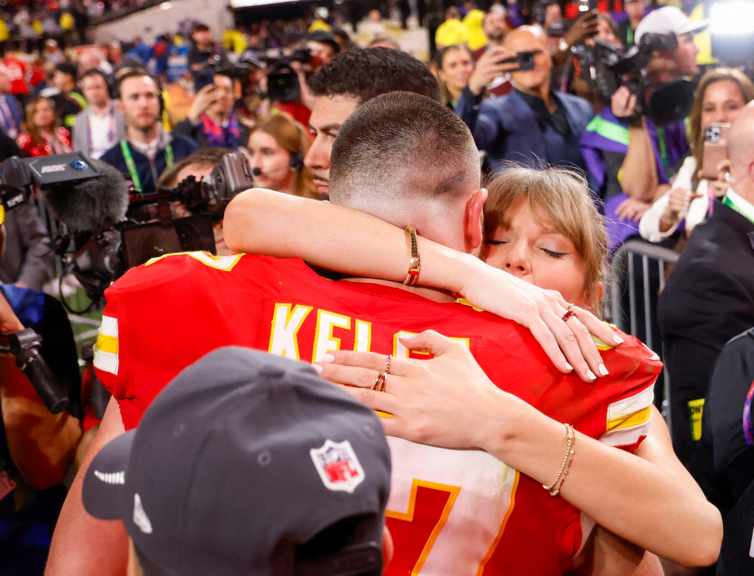 Travis Kelce hugging Taylor Swift