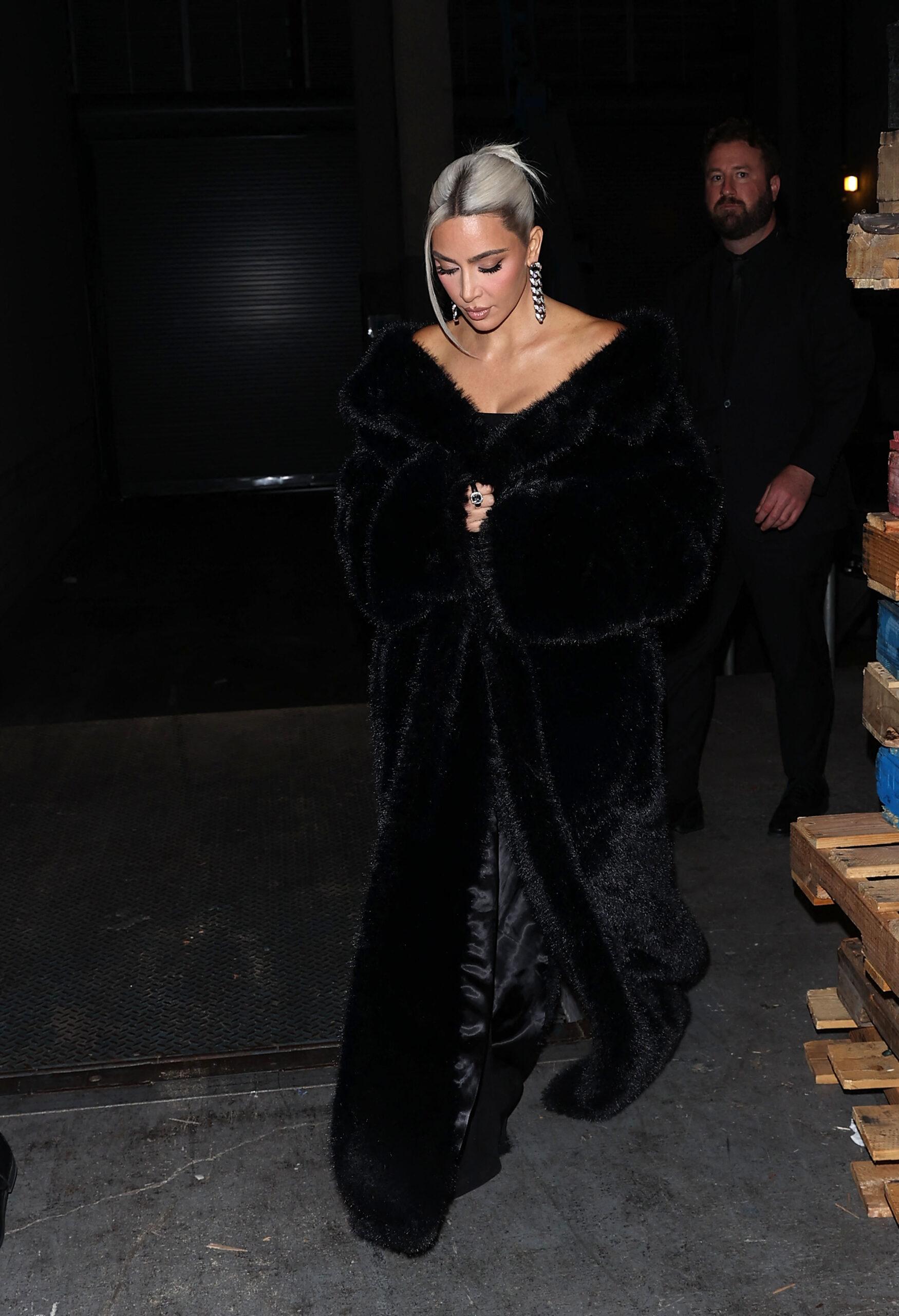 Kim Kardashian stunned in a black Faux Fur coat showing off her new platinum blonde hair at the Homeboy Industries Gala where she was honored